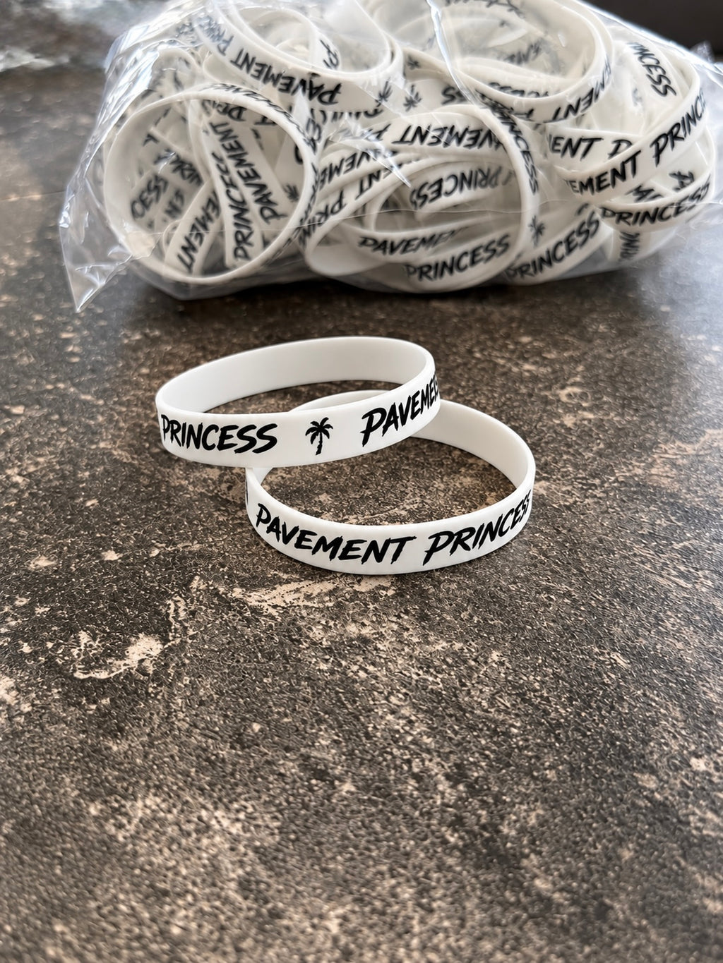 White "pavement princess" phone holder / bracelet
